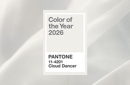 Pantone Color of the Year 2026 is Cloud Dancer, 11-4201, displayed against a soft white fabric background.
