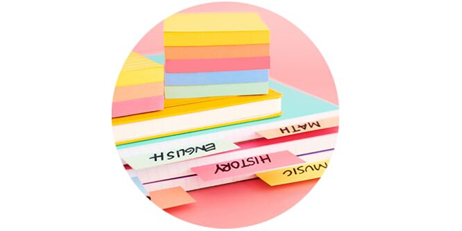 Stacks of colorful Super Sticky post-it notes.
