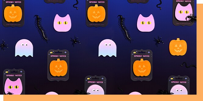 Post-it Spooky Notes Halloween sticky note pads in jack-o-lantern, pumpkin, ghost, and cat shapes with spider and centipede decorations on dark blue background
